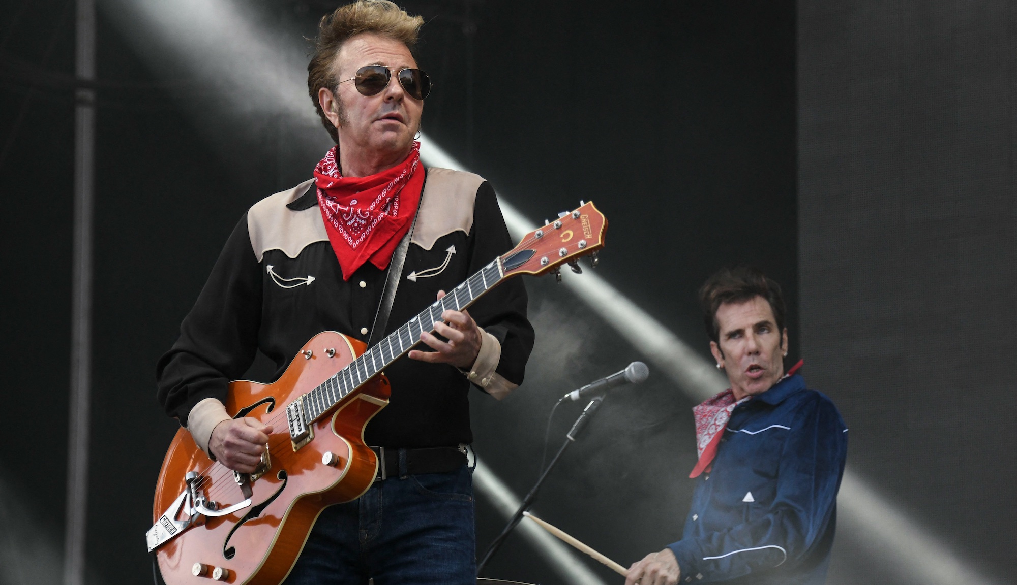 The Stray Cats&#039; Brian Setzer (left) and Slim Jim Phantom perform onstage in Belfort, France on July 7, 2019