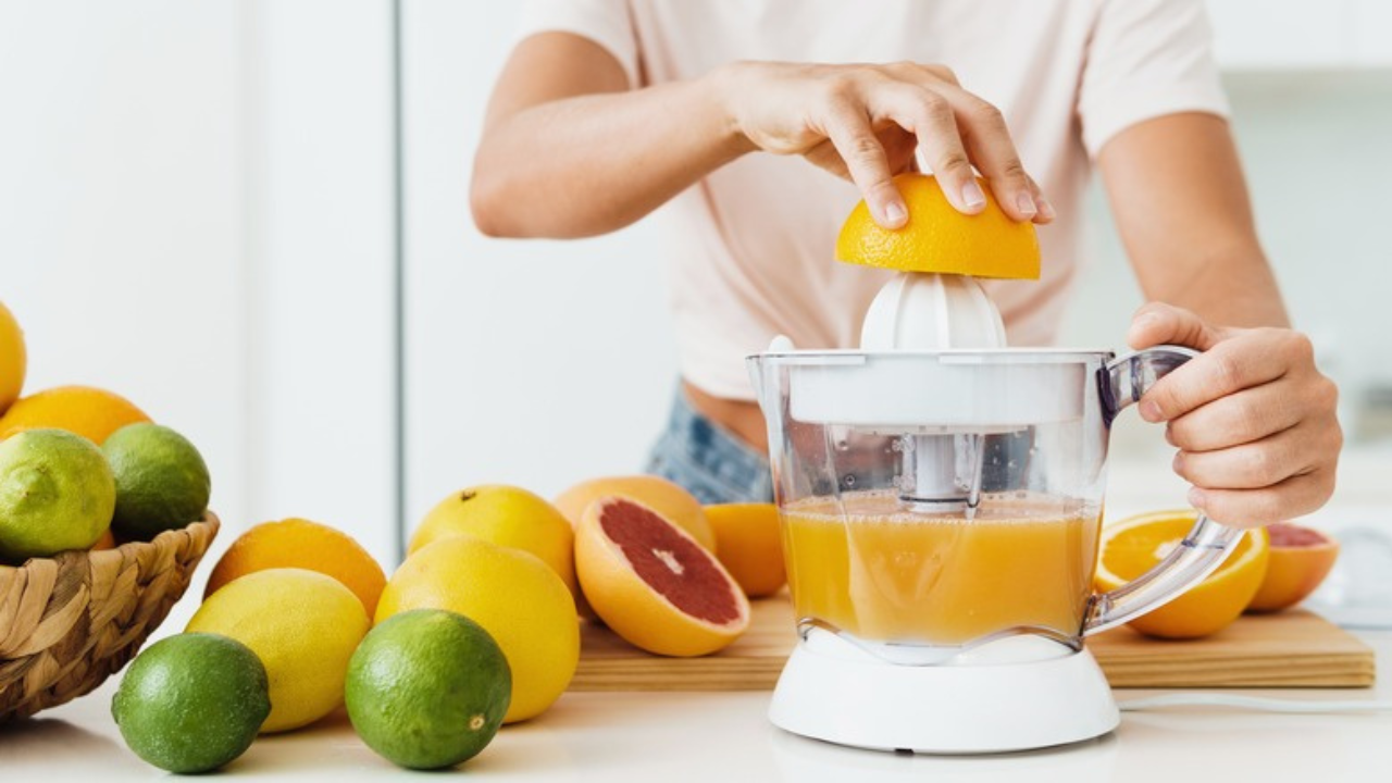 man making natural juice