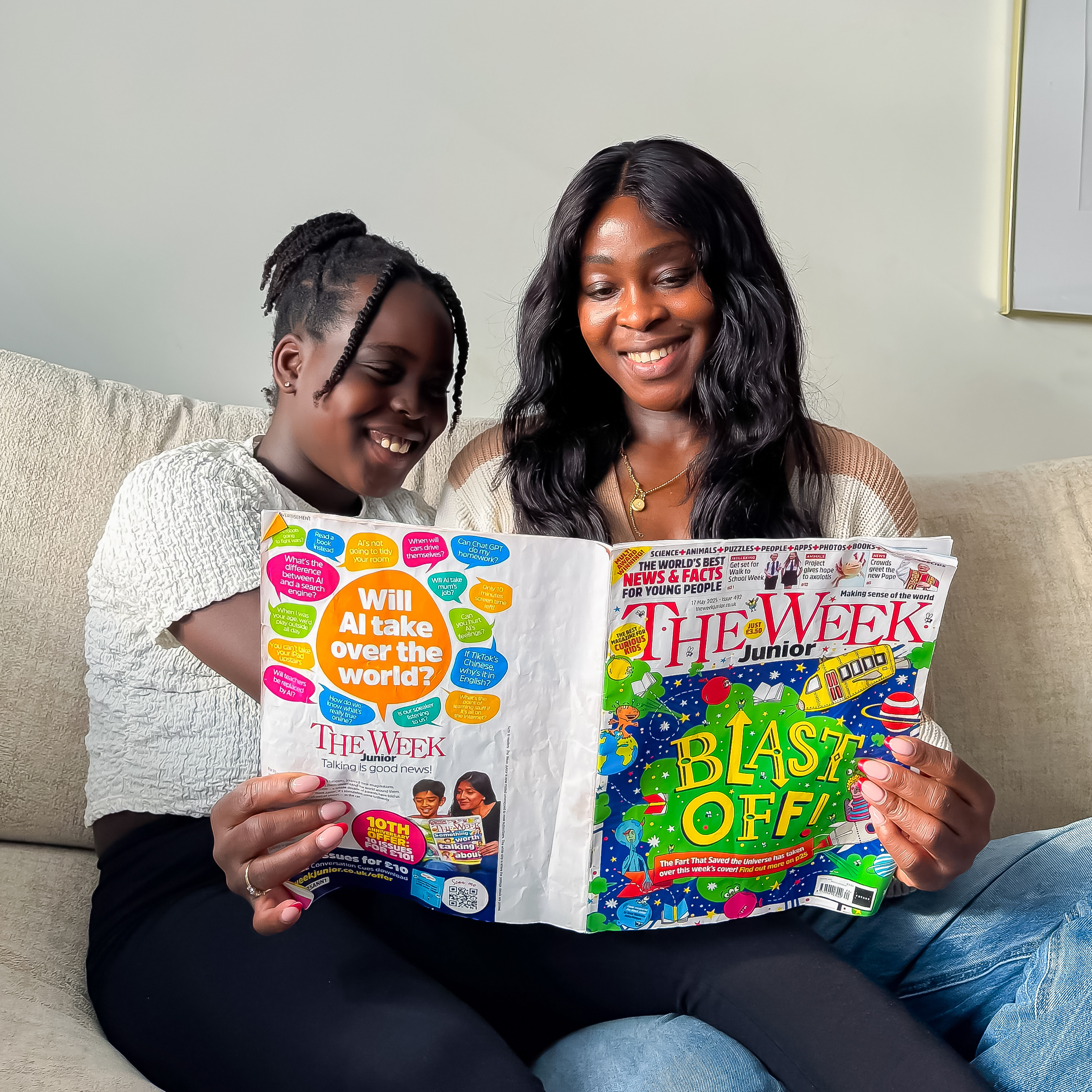 Funke Koduah reading The Week Junior with her daughter
