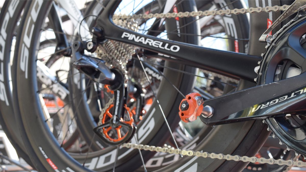 The Danish team accent their Pinarellos with orange pedals from Speedplay and CeramicSpeed's OSPW system