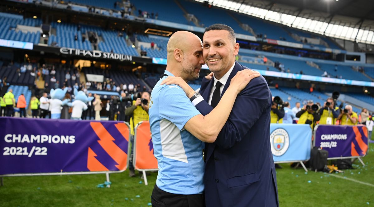 Manchester City chairman Khaldoon Al Mubarak embraces Manchester City manager Pep Guardiola during the celebrations after the club won the 2021/22 Premier League title.