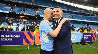 Manchester City chairman Khaldoon Al Mubarak embraces Manchester City manager Pep Guardiola during the celebrations after the club won the 2021/22 Premier League title.