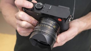 Leica Q3 camera in the hand