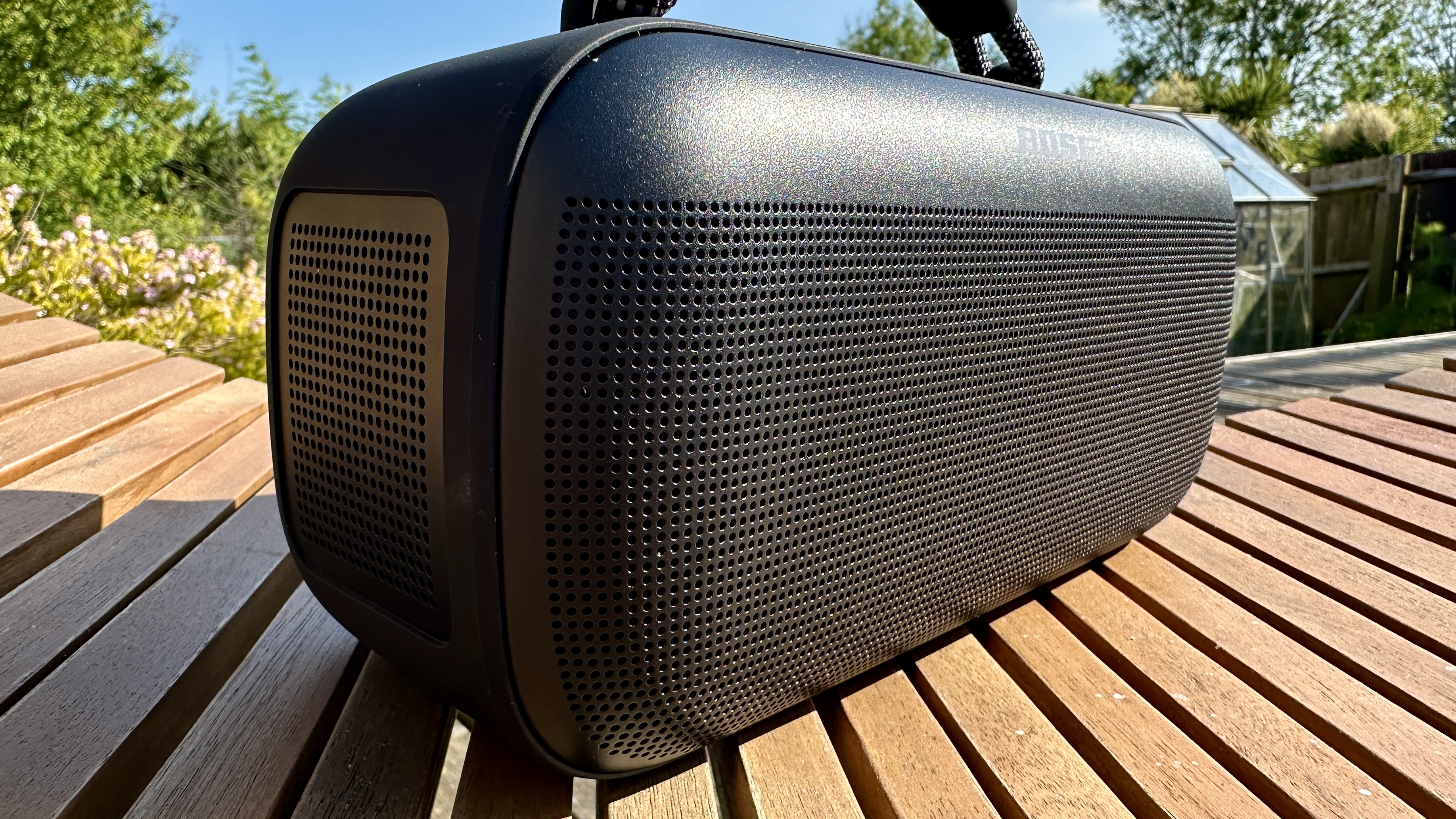 Bose SoundLink Max Bluetooth speaker on a wooden table