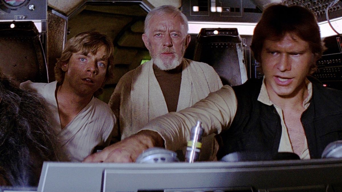 Mark Hamill, Alec Guinness and Harrison Ford in Star Wars Millennium Falcon cockpit