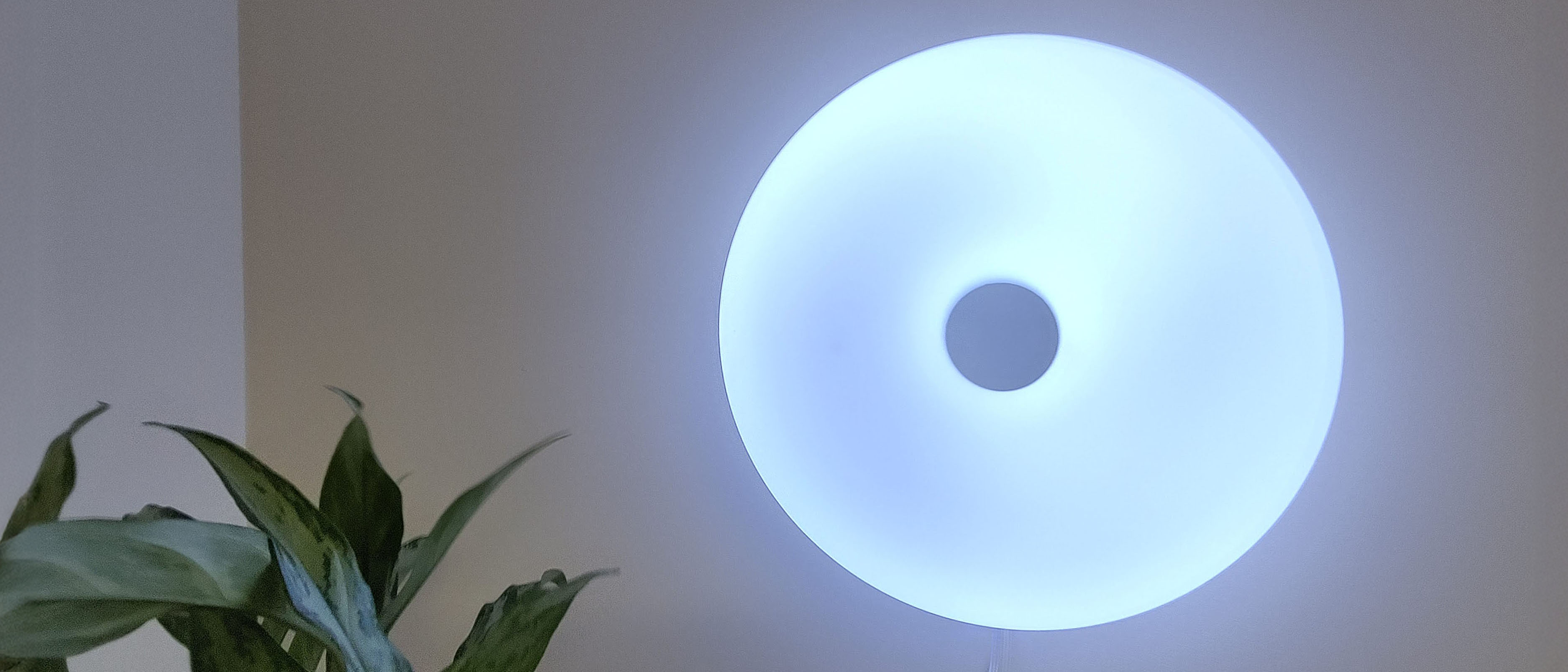IKEA Varmblixt lamp mounted on wall, illuminated blue
