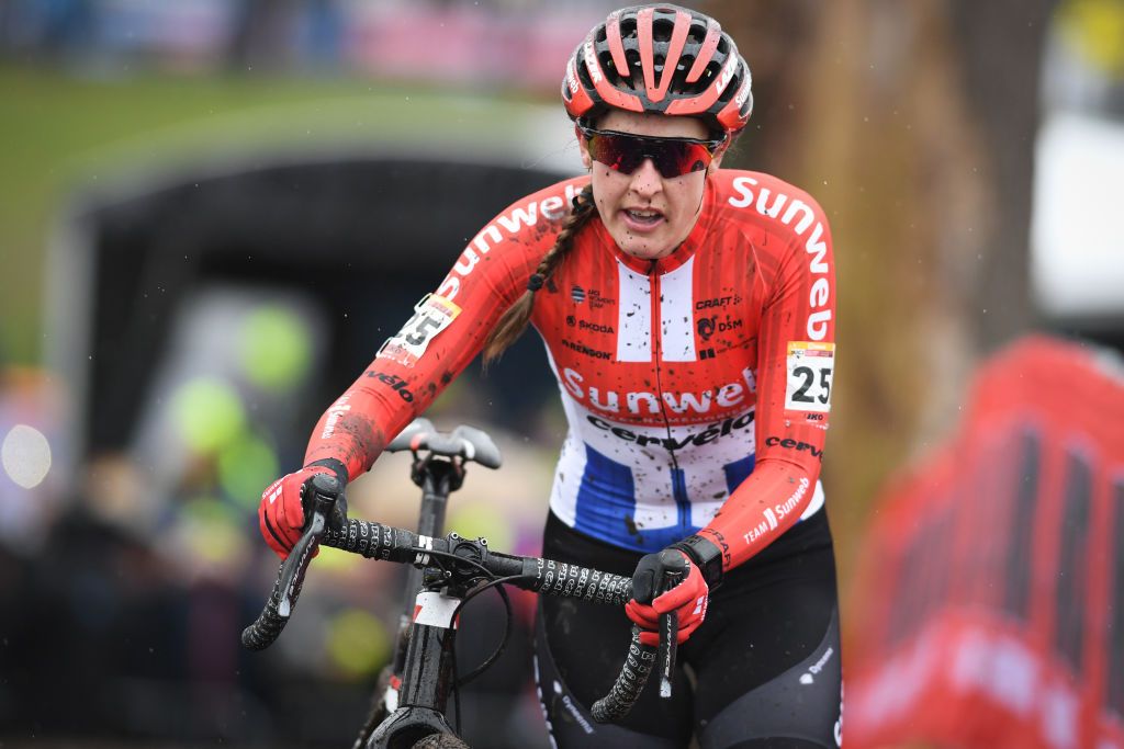 Lucinda Brand walks through the mud