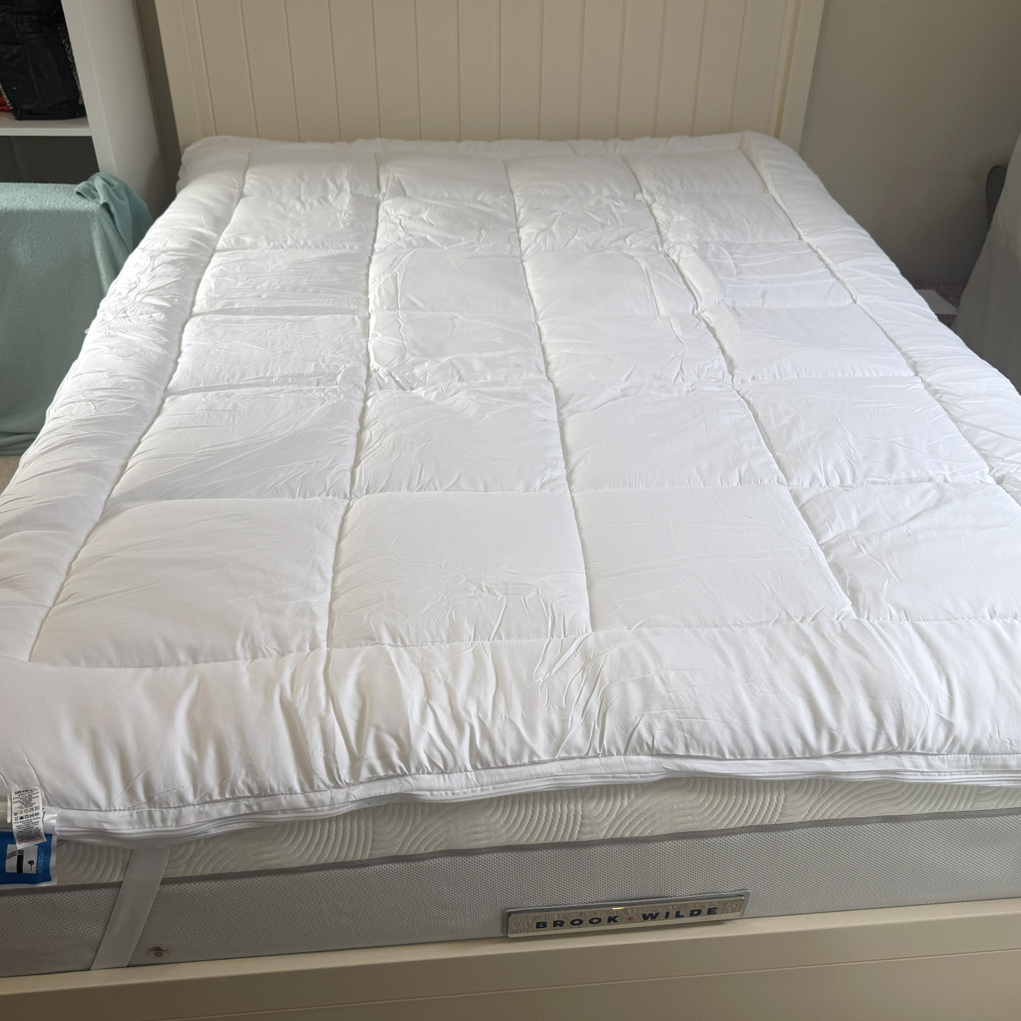 Next White Sleep In Comfort Dual Layer Mattress Topper being tested on a bed at home