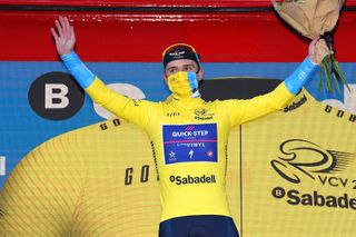 TORRALBA DEL PINAR SPAIN FEBRUARY 02 Remco Evenepoel of Belgium and Team QuickStep Alpha Vinyl celebrates at podium as yellow leader jersey winner during the 73rd Volta A La Comunitat Valenciana 2022 Stage 1 a 1667km stage from Les Alqueries to Torralba Del Pinar 735m VCV2022 on February 02 2022 in Torralba Del Pinar Spain Photo by Dario BelingheriGetty Images