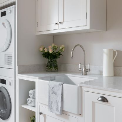 kitchen with cabinet and tap