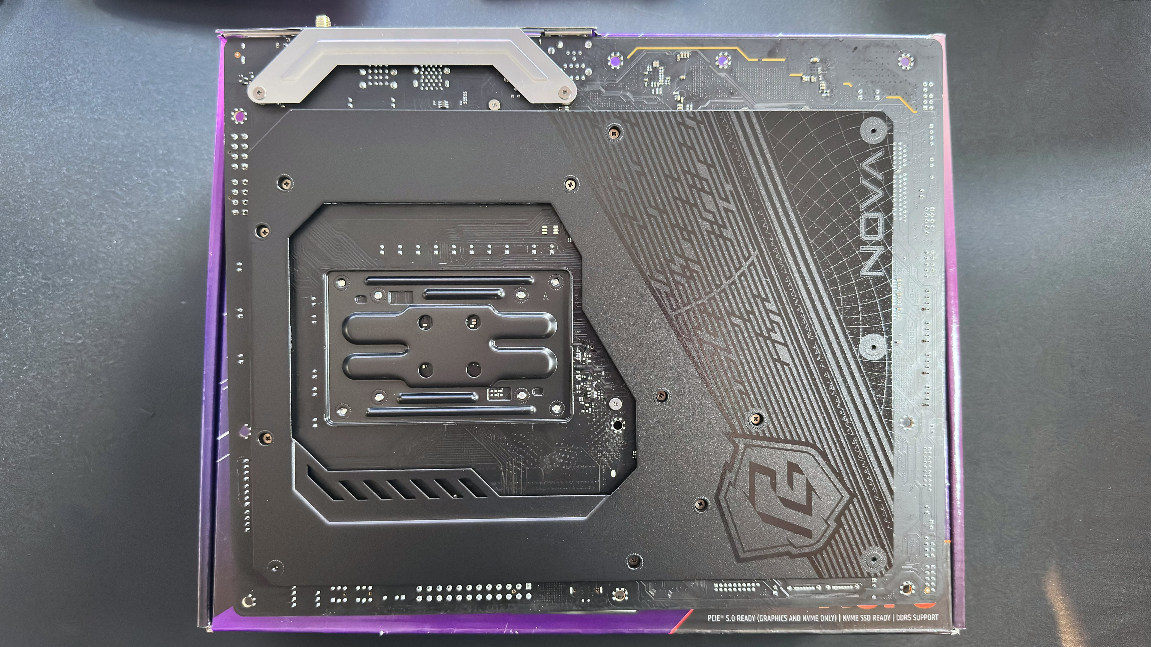 An overhead photo of the backside of the ASRock Phantom Gaming X870 Nova WIFI motherboard