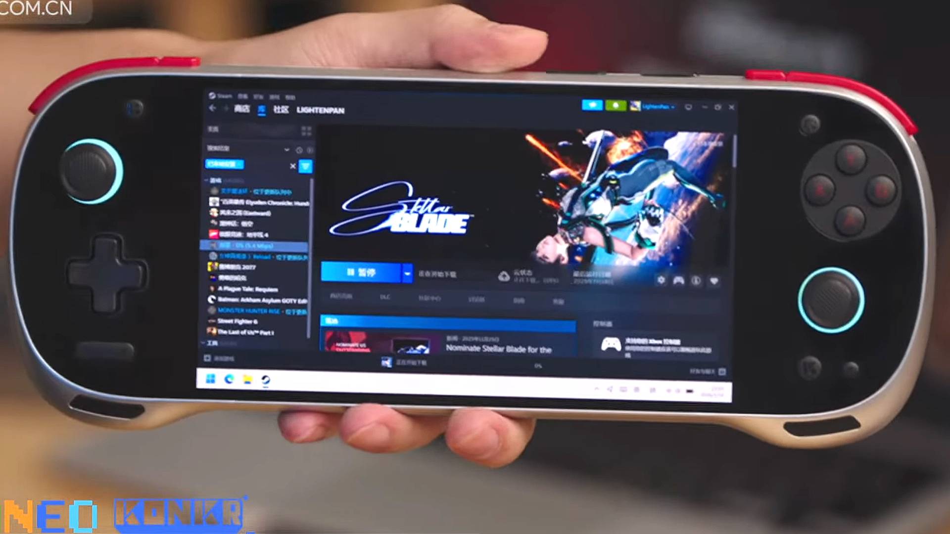 Hand holding Konkr Fit handheld with Steam open on screen and Stellar Blade selected.