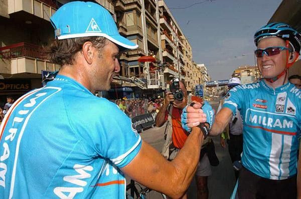Petacchi gets congratulated by his team-mate on a job well done