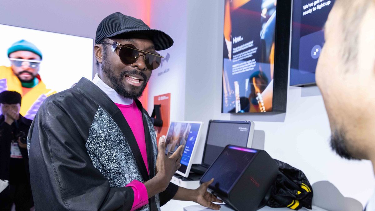 Will.i.am speaking about LG&#039;s XBoom speakers at CES 2025, wearing all black with a black cap