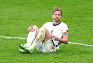 England’s Harry Kane went down under a challenge in the second half