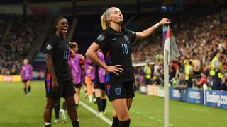 Chloe Kelly of England celebrates scoring her team's second goal from a rebound following a saved penalty in extra-time during the UEFA Women's EURO 2025 Semi-Final