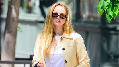 Jennifer Lawrence wears a jacket and jeans with her mesh flats in New York City