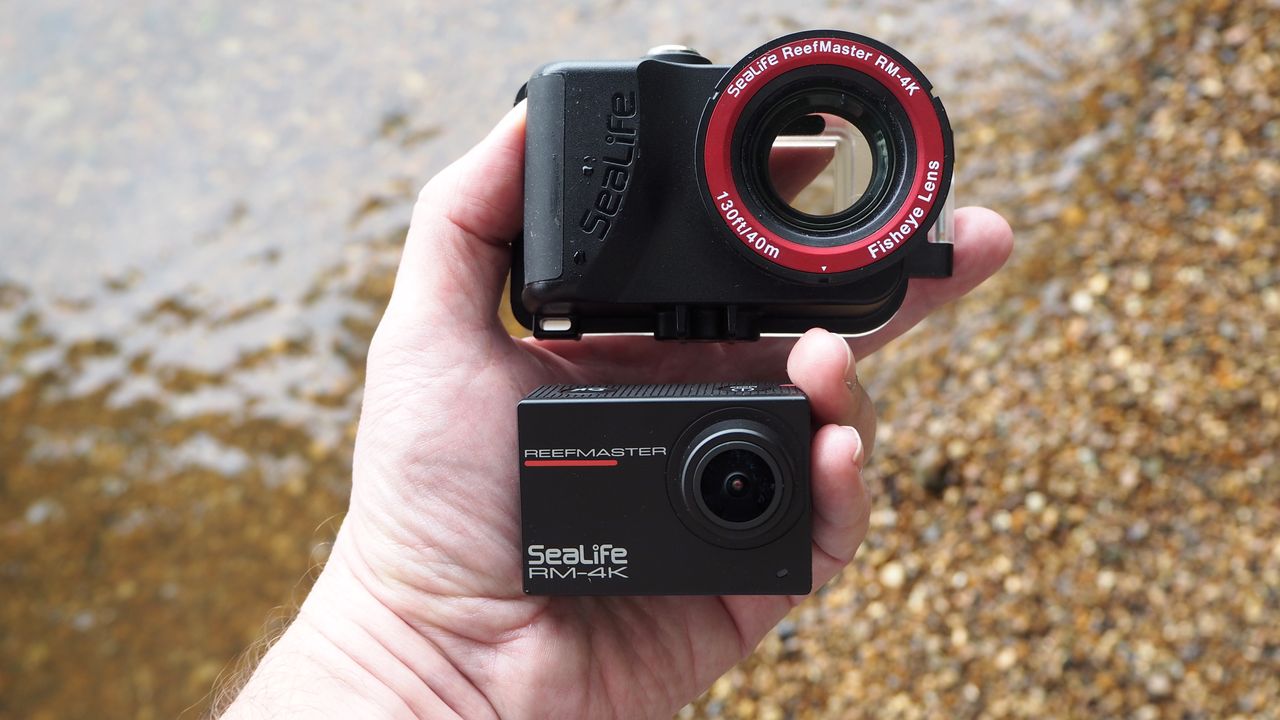 SeaLife ReefMaster RM-4K waterproof camera on a stony waterside