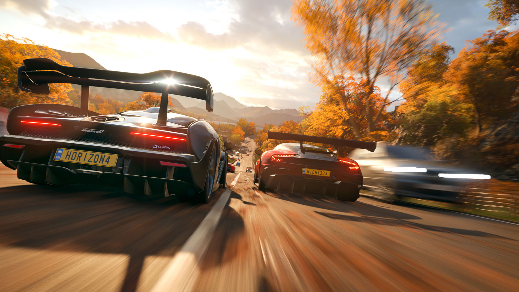 Cars racing in the Fall (surrounded by orange leaves) in Forza horizon 4