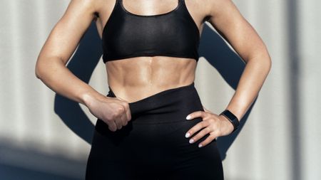 a photo of a woman with strong ab muscles