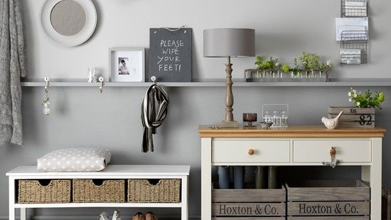 hallway with grey wall and shoe rack