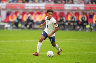 Tyler Adams of the United States looking for an open man during a game between Japan and USMNT at Düsseldorf Arena on September 23, 2022 in Düsseldorf, Germany.