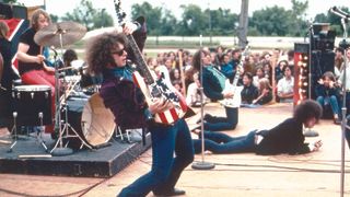 The rock group MC5 (L-R Dennis "Machine Gun" Thompson, Wayne Kramer, Fred "Sonic" Smith and Rob Tyner) perform live in 1969 in Mount Clemens, Michigan. 