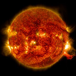 NASA's Solar Dynamics Observatory spotted this solar flare (right, middle) and outburst of plasma (right, below) on Oct. 2, 2014.