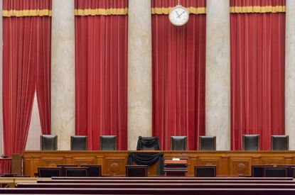 Supreme Court Justice Antonin Scalia’s courtroom chair is draped in black to mark his death.