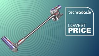 A Dyson stick vacuum on a blue and green background