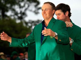 Spieth being presented with the Green Jacket. Credit: Jamie Squire (Getty)