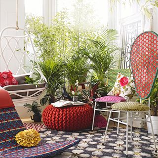 conservatory with plants and chairs