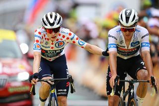 ISOLA 2000 FRANCE JULY 19 LR Jonas Vingegaard Hansen of Denmark and Team Visma Lease a Bike Polka Dot Mountain Jersey and Remco Evenepoel of Belgium and Team Soudal QuickStep White Best Young Rider Jersey cross the finish line during the 111th Tour de France 2024 Stage 19 a 1446km stage from Embrun to Isola 2000 2022m UCIWT on July 19 2024 in Isola 2000 France Photo by Dario BelingheriGetty Images