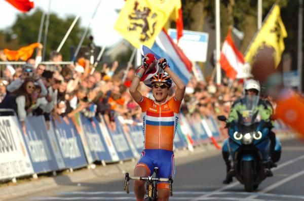 Vos grabbed a Netherlands flag before crossing the line