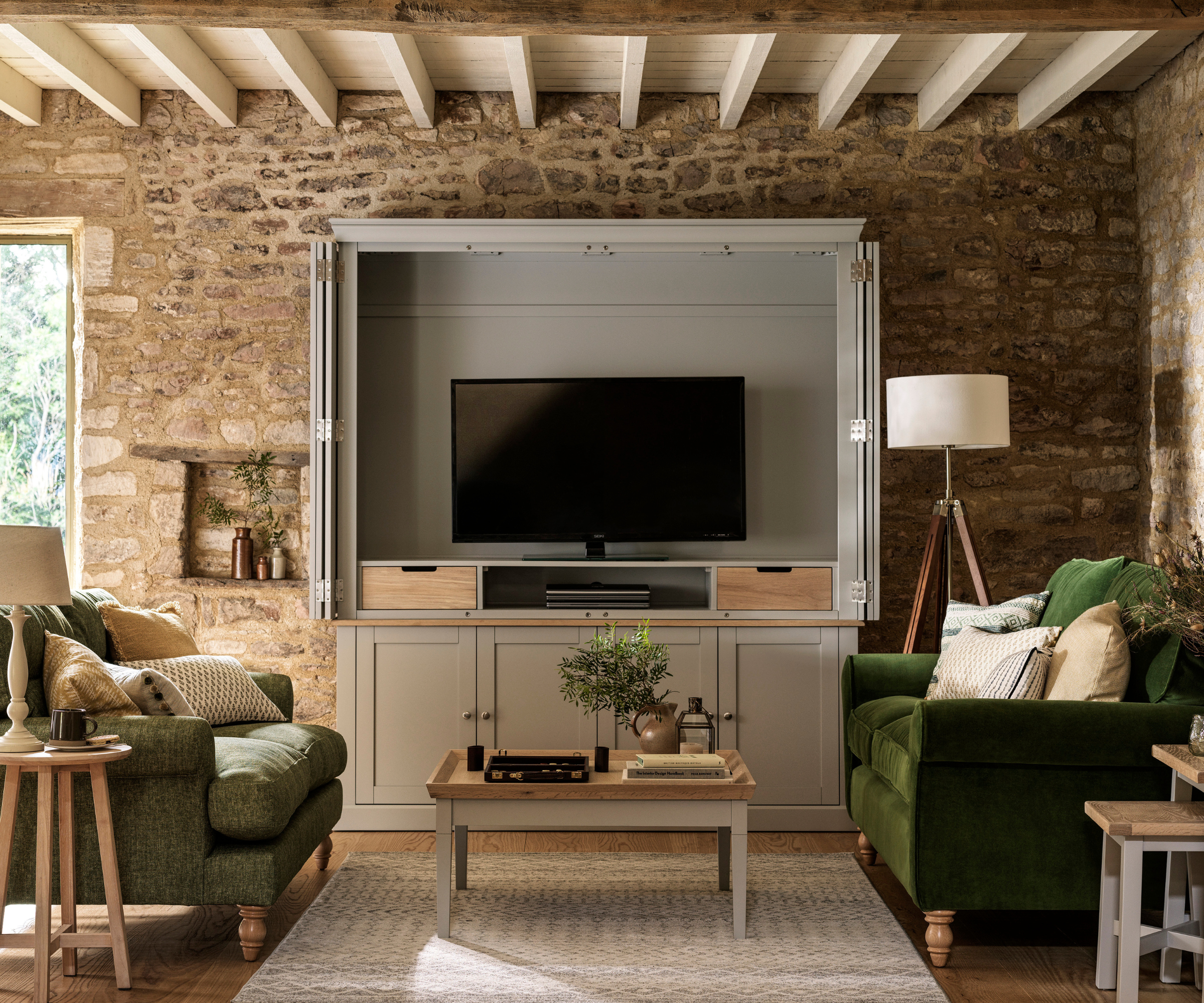 TV inside a cabinet with doors and cabinets at the bottom