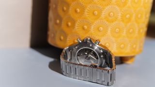 The Certina DS-7 Chrono Auto against a yellow pot