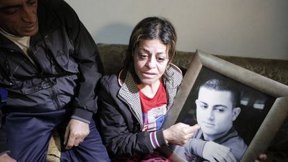 The parents of Arab-Israeli Mohammed Musallam at the family's home in the East Jerusalem