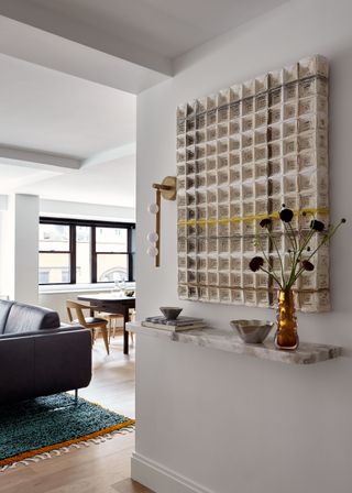 floating marble console table in entry hallway