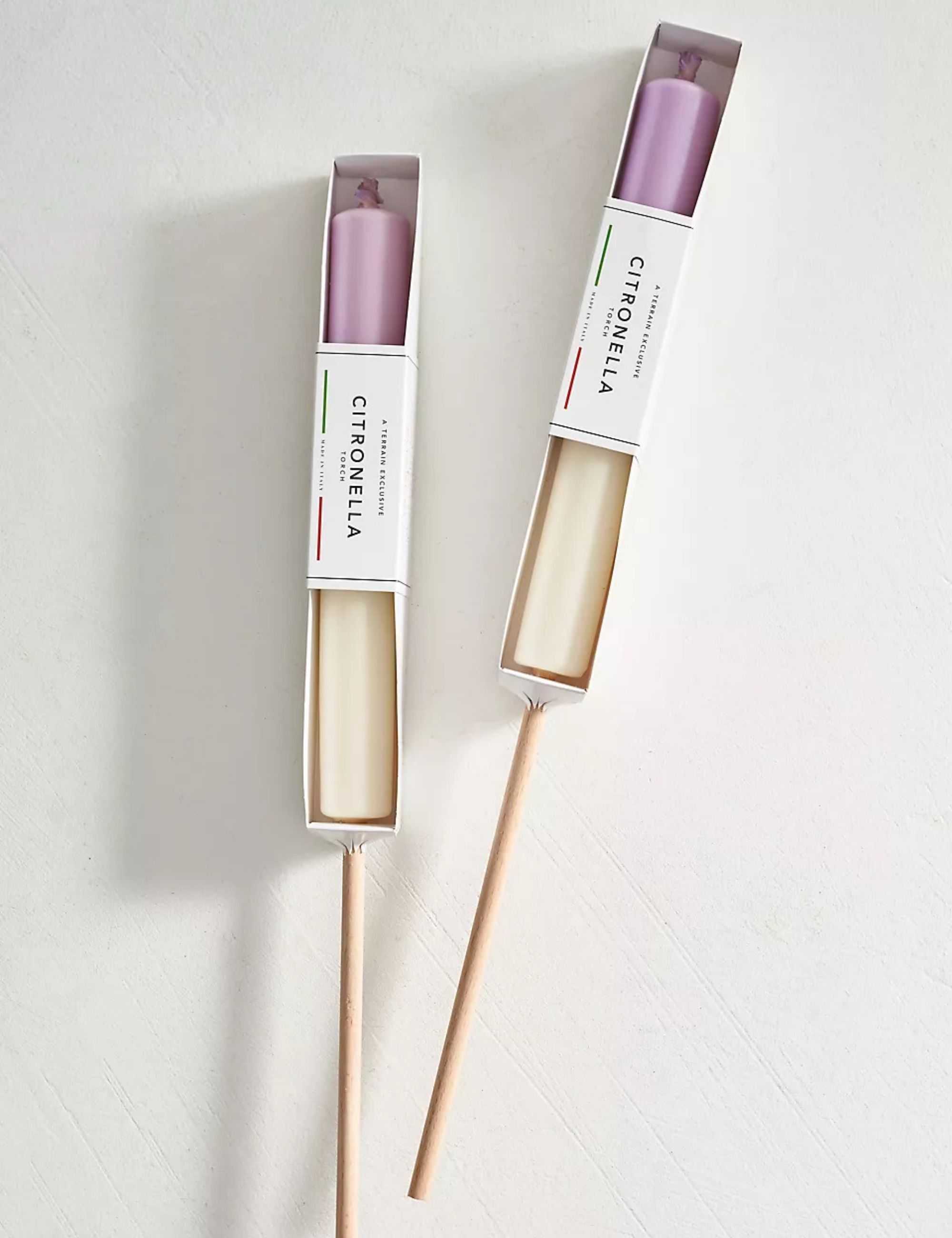 Citronella candles in white and purple
