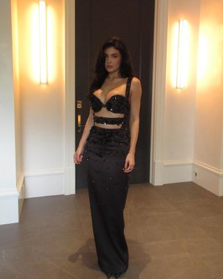 Kylie Jenner at the 2025 Oscars wearing a black beaded dress