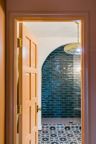 A bathroom with shower tiles laid horizontally