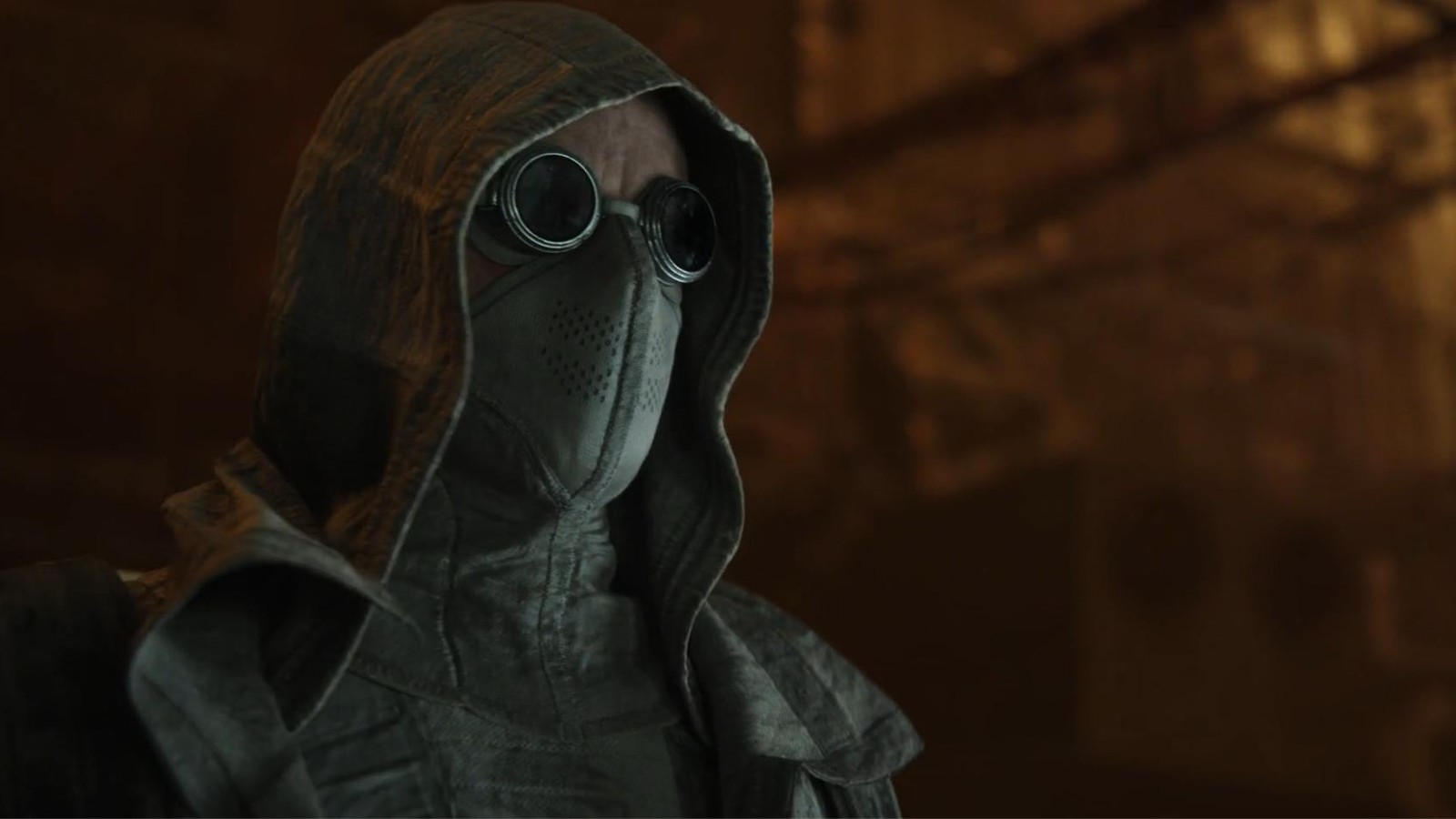 Screenshot from the animated tv series Love, Death & Robots. This still is from the episode Snow in the Desert. Here we see a close up of a masked man wearing round googles with his hood up to protect him from his desert surroundings.