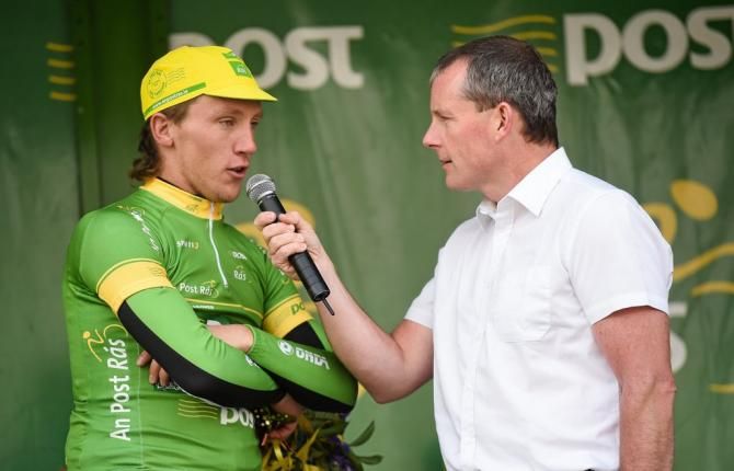 Shane Archbold (An Post Chain Reaction) is interviewed by MC Cian Lynch after being presented with the points leader jersey