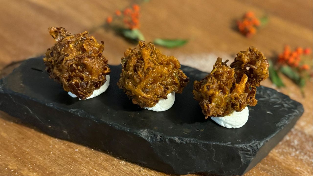 Three sprout bhajis, served on a slate platter