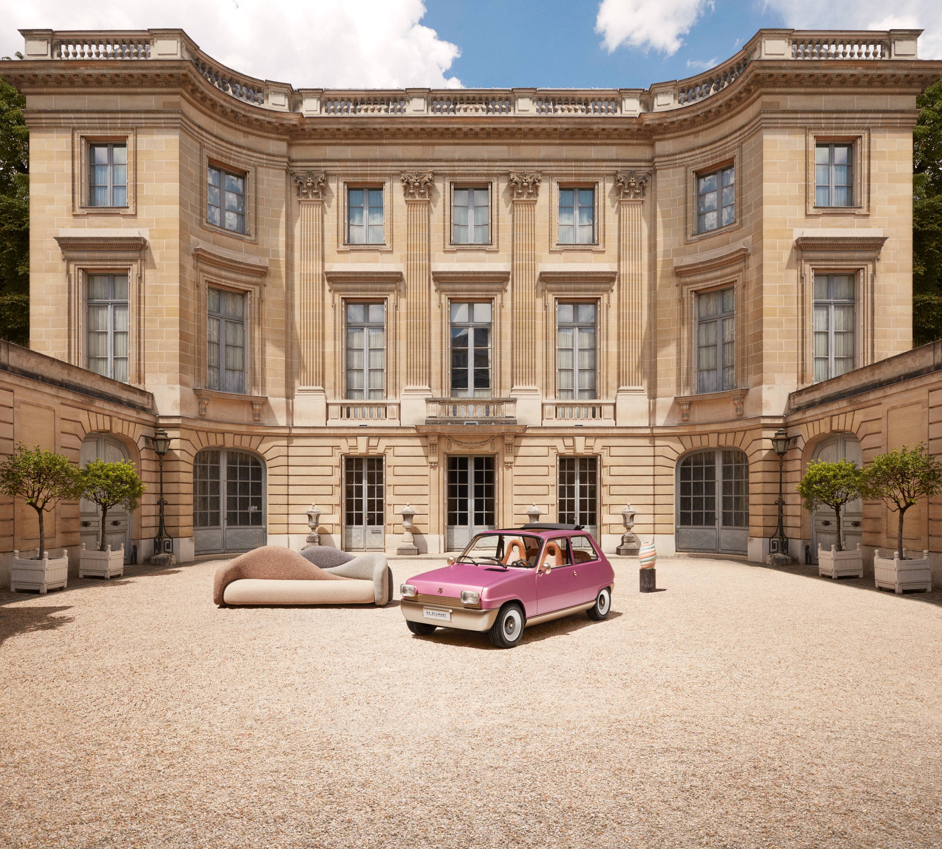 Pink Renault 5 Diamant by Pierre Gonalons, pictured beside a sofa