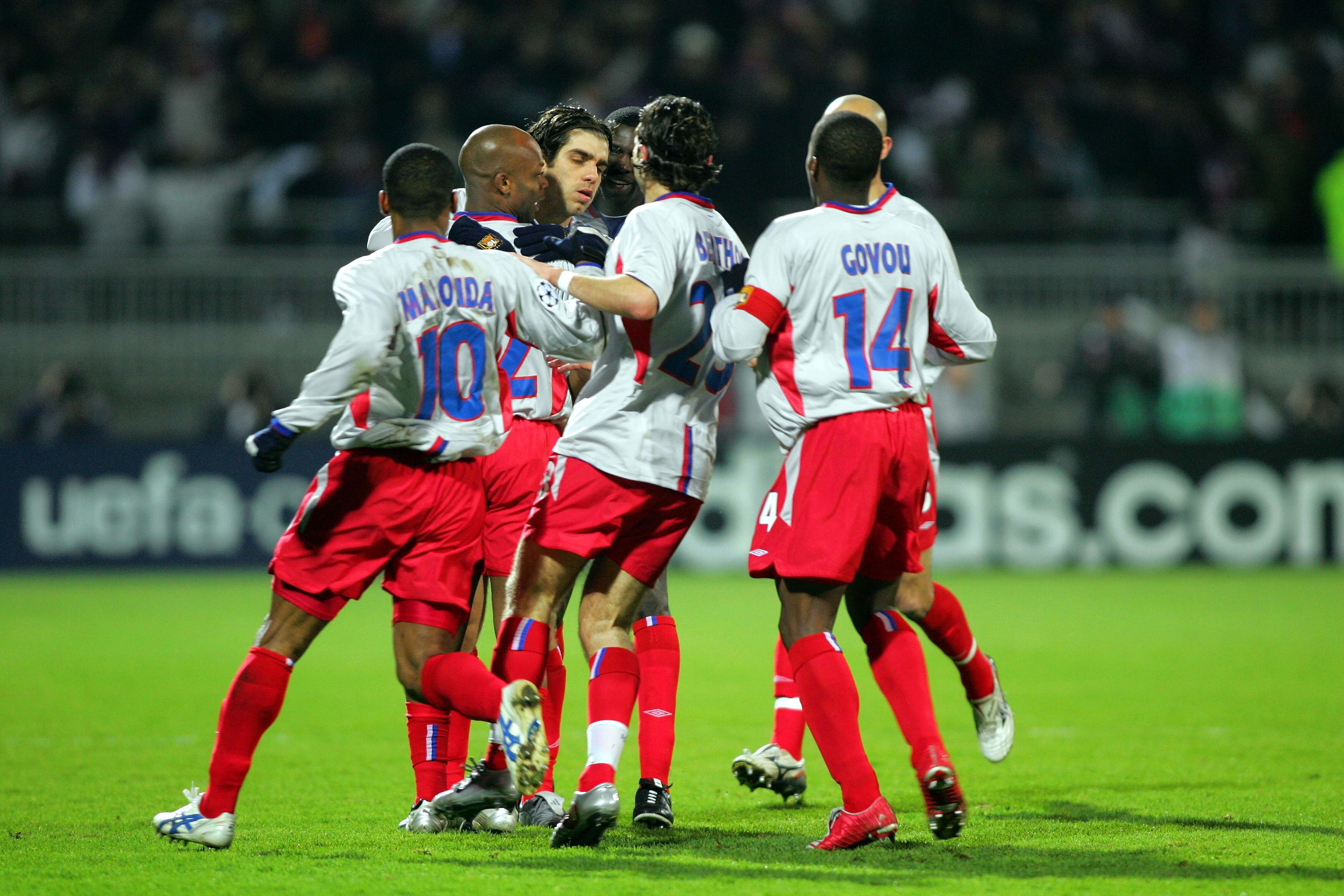 Lyon players celebrate a goal against Werder Bremen in the Champions League in March 2005.