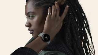 Woman wearing Google Pixel Watch and headphones