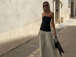 @hannahlewisstylist wearing a summer outfit including a color-block strapless dress.