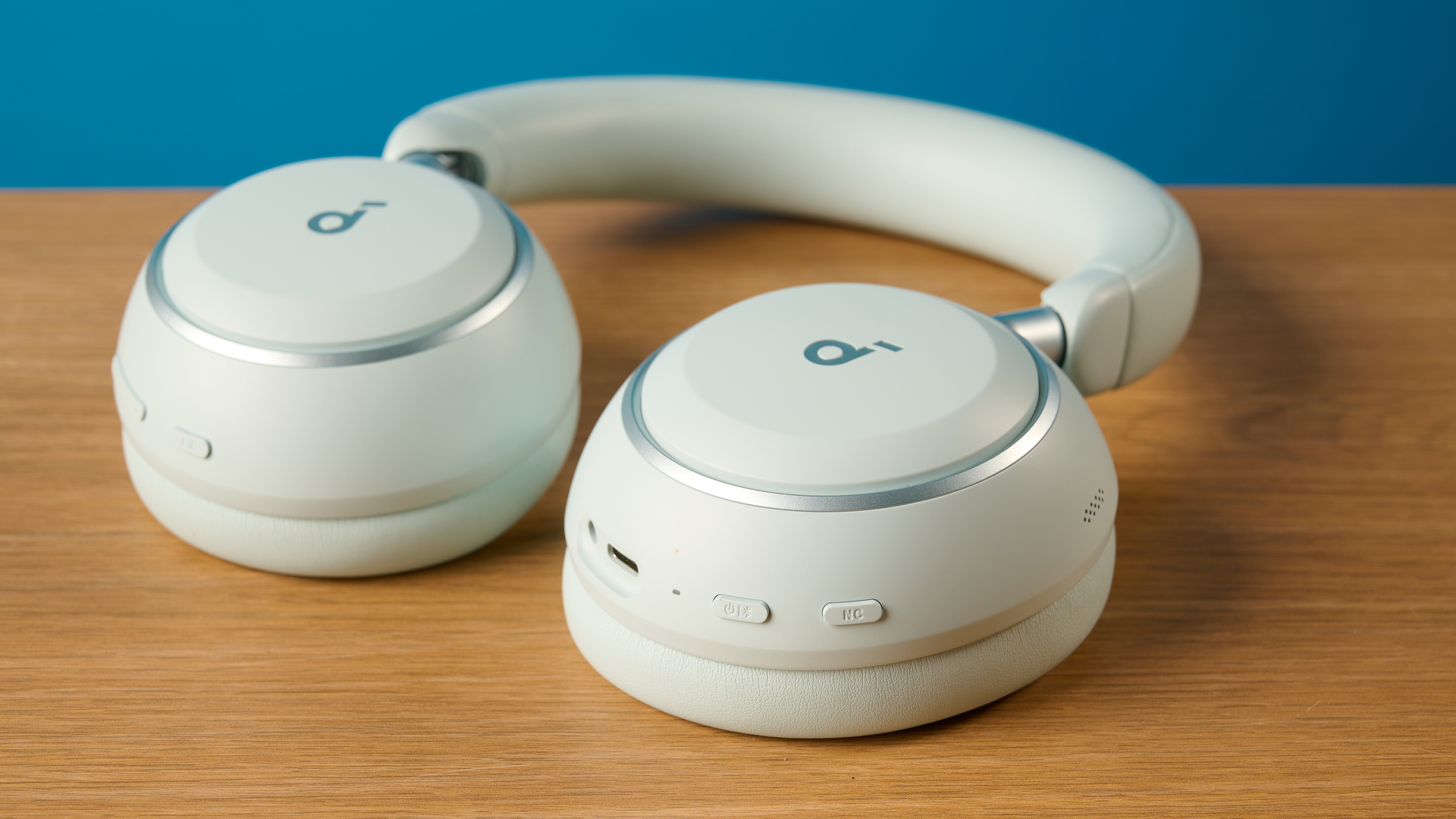the soundcore space 2 headphones in white photographed against a blue tom's guide background