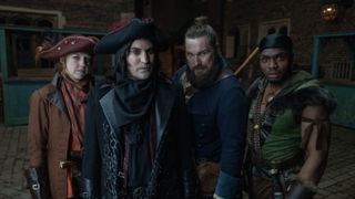 Ellie White in a brown hat and coat as Nell, Noel Fielding in a black hat and coat as Dick, Mark Wootton in a blue coat as Moose and Duayne Boachie in a black hat and green jerkin as Honesty in The Completely Made-Up Adventures of Dick Turpin.